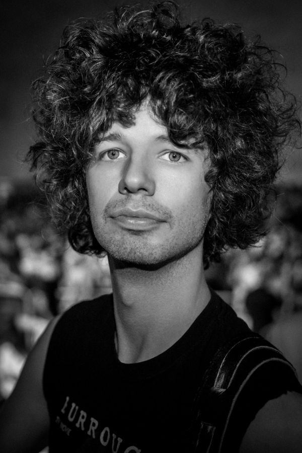 Fede Aubele, Rome, Italy: black and white portrait of a man with curly hair. Photograph by Marcus Vallance.